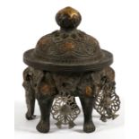 A Chinese bronzed censer standing on five mask capped legs 11cm (4.25ins) high