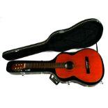 A Spanish acoustic guitar with spurious Jose Ramirez label, in hard carry case.