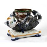 A Victorian Gerbing & Stephan majolica centrepiece, the bowl supported by a cat on a cushion,