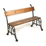 A Victorian cast iron garden bench with pine board seat and back, 120cms (47.25ins) wide.