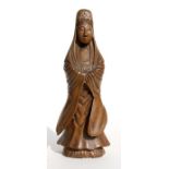 A Chinese carved wooden figure depicting Guanyin, 20cms (8ins) high.