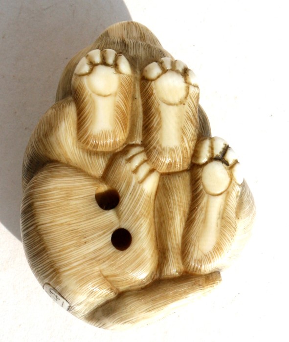 A signed Japanese ivory netsuke in the form of a puppy, 4.5cms (1.25ins) long. - Image 2 of 3