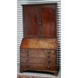 A 19th century mahogany bureau bookcase, the pair of panelled doors enclosing a shelved interior,
