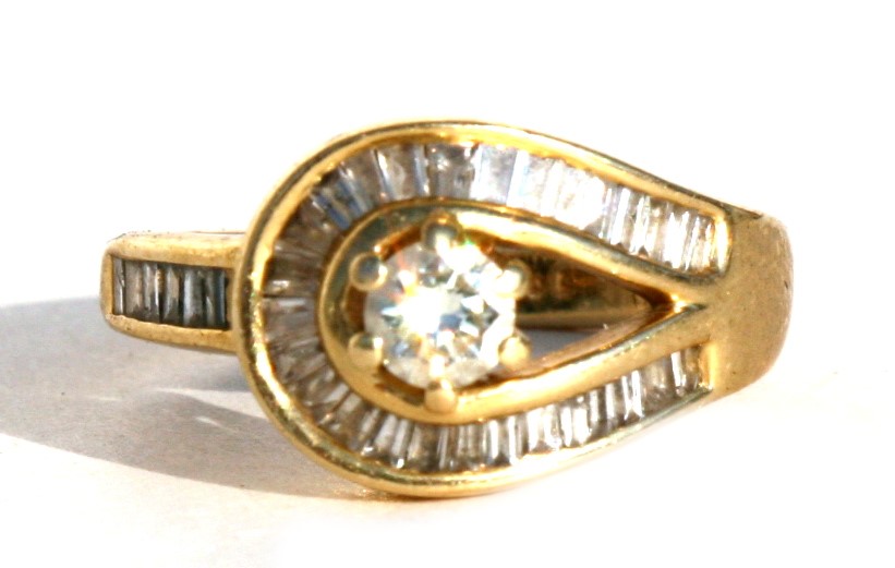 An 18ct gold diamond ring with central diamond surrounded by baguette cut diamonds, approx UK - Image 2 of 2