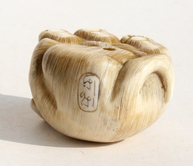 A signed Japanese ivory netsuke in the form of a puppy, 4.5cms (1.25ins) long. - Image 3 of 3