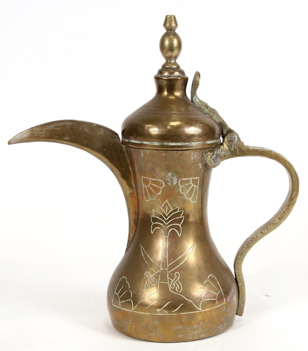 A Turkish / Islamic brass dallah coffee pot, 278cms (10.5ins) high.