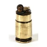 A brass trench art lighter, 4cms (1.5ins) high.