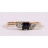 A 9ct gold dress ring set with a central square blue stone flanked by two white stones, approx UK