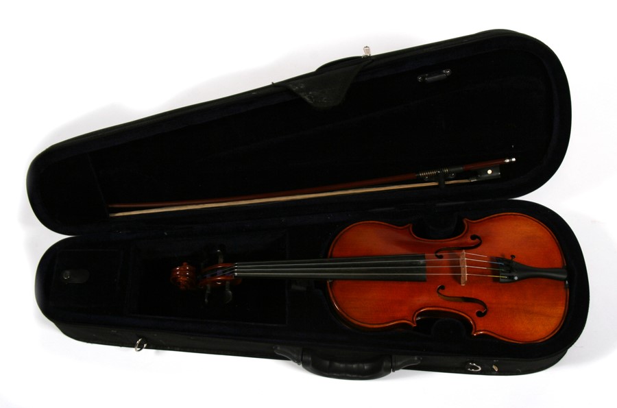 A one piece back violin and bow, cased.Condition Report Violin back measures 35cms.