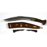 An Indian kukri in a hardwood scabbard, 41cms (16ins) long.