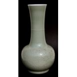 A large Chinese celadon glaze vase decorated in slight relief with chrysanthemums and foliate