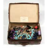 An Osilite suitcase containing a large quantity of costume jewellery.