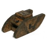 A large WW1 trench art hand carved wooden tank money box with moving machine guns. 27cms (10.5ins)