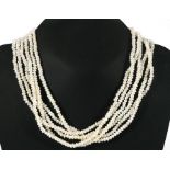 A multi strand pearl necklace with 9ct gold clasp, 46cms (18ins) long.