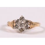 A 9ct gold diamond cluster ring, approx UK size 'M'.