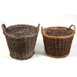 Two wicker log baskets, 50cms (19.75ins) diameter (2).