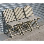 Three painted teak folding garden chairs (3).