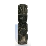 A South American volcanic stone figure, 23cms (9ins) high.