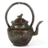 A Chinese metal teapot with fo dog finial and painted decoration, 15cms (6ins) high.