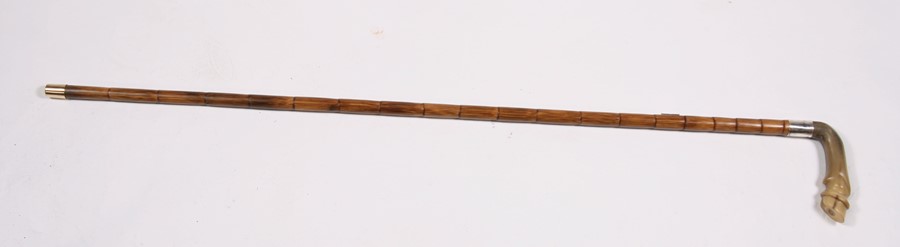 A sword stick, having a horn handle in the form of a horses hoof, 91cms (35.75ins) long.