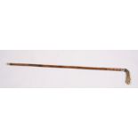 A sword stick, having a horn handle in the form of a horses hoof, 91cms (35.75ins) long.