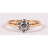 An 18ct gold diamond cluster ring, approx UK size 'M'.