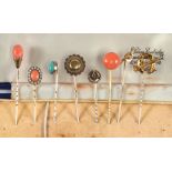 Eight 9ct gold and yellow metal stick pins to include coral examples (8).Condition Report One marked