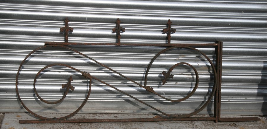 A Victorian wrought iron bracket, 107cms (42ins) wide.