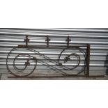 A Victorian wrought iron bracket, 107cms (42ins) wide.