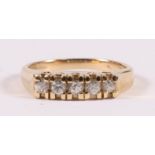 A 9ct gold dress ring set with five white stones, approx UK size 'K'.
