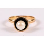 A yellow metal (tests as 18ct) ring set with a single pearl. Appox UK size L