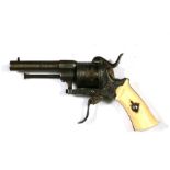 A ladies steel six-shot pin fire purse pistol with ivory grip, 17cms (6.75ins) long.