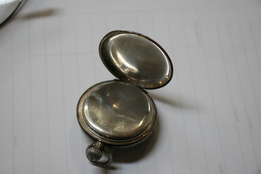 A silver open faced pocket watch, the white enamel dial with Roman numerals and subsidiary seconds - Image 4 of 6