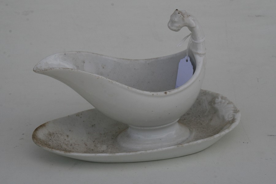 A 19th century white glazed gravy boat on stand with lion mask handle.Condition Report Good - Image 5 of 5