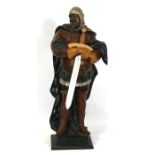 A large painted terracotta figure in the form of a knight, 82cms (32.25ins) high.