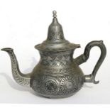 A pewter teapot with incised decoration with bee mark to underside, 20cms (8ins) high.