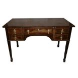 A 19th century mahogany writing table with an arrangement of five drawers, on square tapering legs