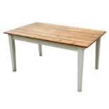 A rectangular topped pine kitchen table on square tapering painted legs, 152cms (60ins) wide.