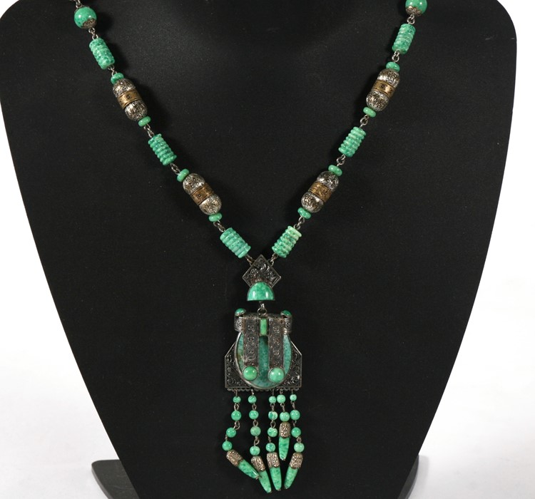An Art Deco style mottled green glass and filigree metal necklace & pendant.