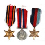 A WW2 medal trio including the Burma Star and posting box together with four 1946 souvenirs from