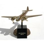 A brass model of the WW2 medium bomber the Bristol Blenheim Mk. IV with spinning propellers standing