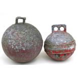 Two vintage aluminium fishing floats, both with remnants of red paint, 23cm (9ins) diameter.