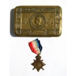 A WW1 Princess Mary tin with a 1914 Mons Star named to 5540 Private FG Austin of the Army Service