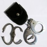 A pair of original Hiatts 1960 handcuffs with key in their leather case together with a pair of