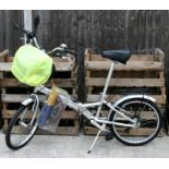 A 5 speed ' Monty 7005 aluminium fold up bicycle with rear view mirror and front bag containing