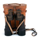 A pair of WWII Bino Prism MkII binoculars numbered 18241, in a leather case.