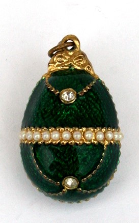 A green enamel egg shaped pendant. 3cm (3.2 ins) high