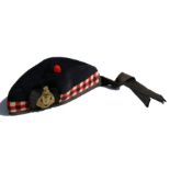 A WWII period Glengarry hat with original brass badge to The Essex Scottish Regiment