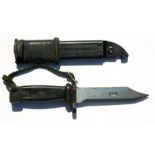 An AK 47 bayonet with combined wire cutter in its scabbard. Blade length 14cms (5.5ins)