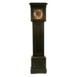 An oak cased long case clock, the silvered dial with roman numerals.